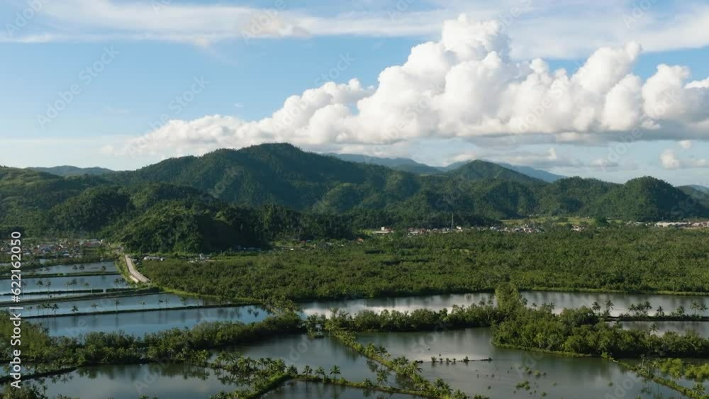 Agricultural farmland of fish in Surigao. Blue sky and clear clouds. Mindanao, Philippines Agricultural farmland of fish in Surigao. Blue sky and clear clouds. Mindanao, Philippines