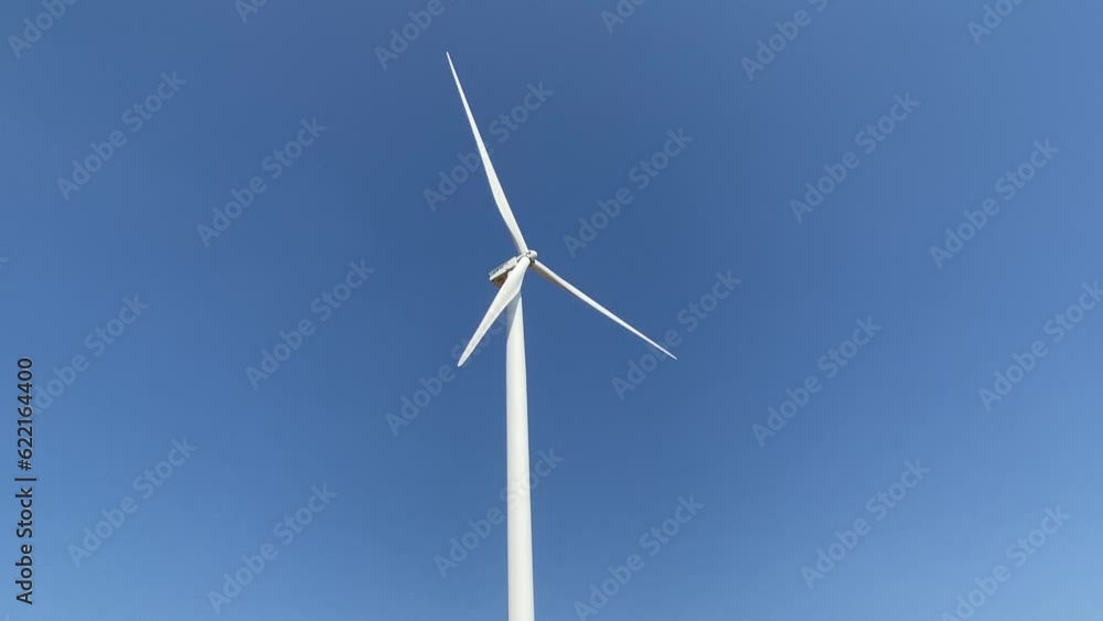 Turbines produce clean energy on high mountains, good air, no pollution, save the world, blue background. Turbines produce clean energy on high mountains, good air, no pollution, save the world, blue background.