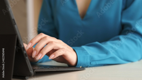 Computer work. Internet business. Marketing expert. Woman specialist professional hands typing on modern laptop keyboard at office workplace. © golubovy