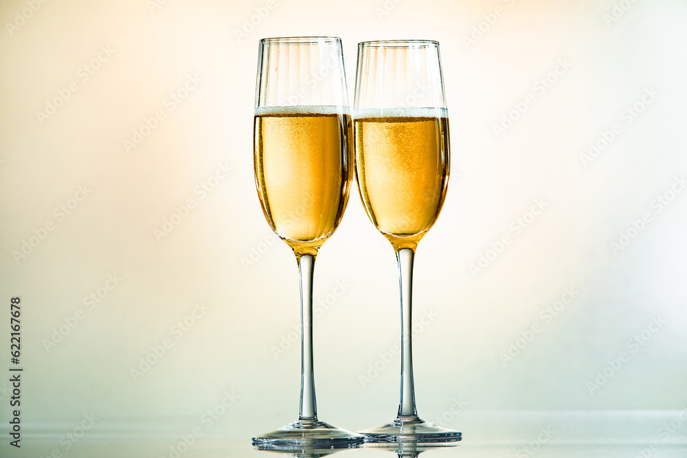 Minimalist image of two glasses of champagne with light tones Minimalist image of two glasses of champagne with light tones