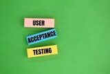 colored paper with the word user acceptance testing