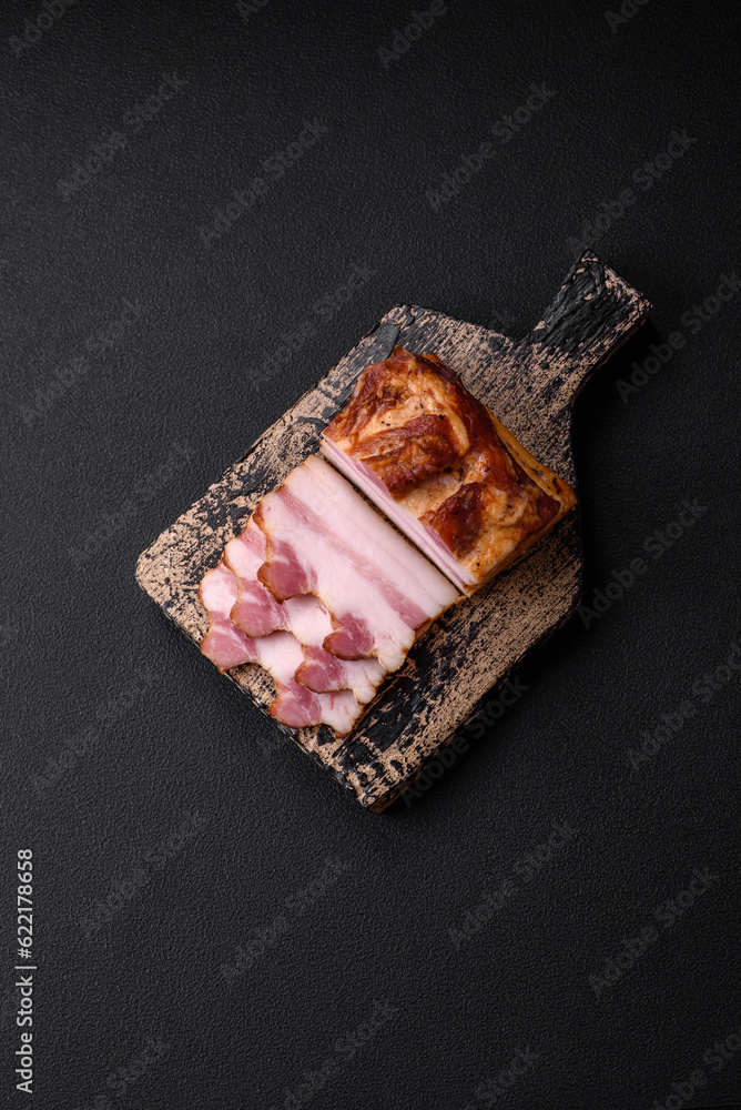 Delicious calorie smoked bacon with salt, spices and herbs Delicious calorie smoked bacon with salt, spices and herbs