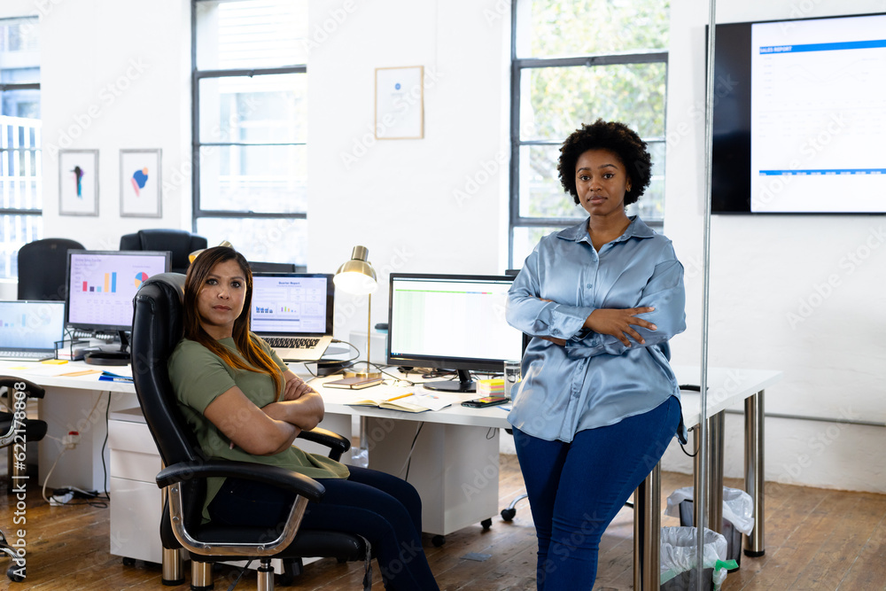 Portrait of diverse casual businesswomen in sunny office Portrait of diverse casual businesswomen in sunny office