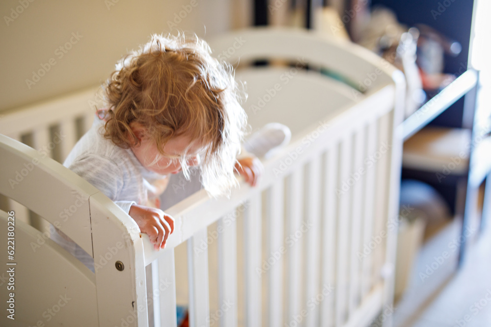 Cute Little Baby Girl Lying in Cot after Sleeping. Healthy Happy Child