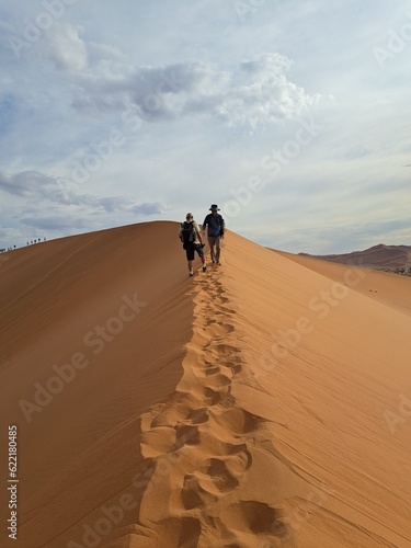 person walking in desert