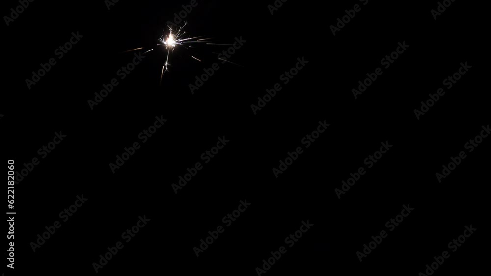 Burning sparkler. Bengal fire on a black background. Holiday concept. Burning sparkler. Bengal fire on a black background. Holiday concept.