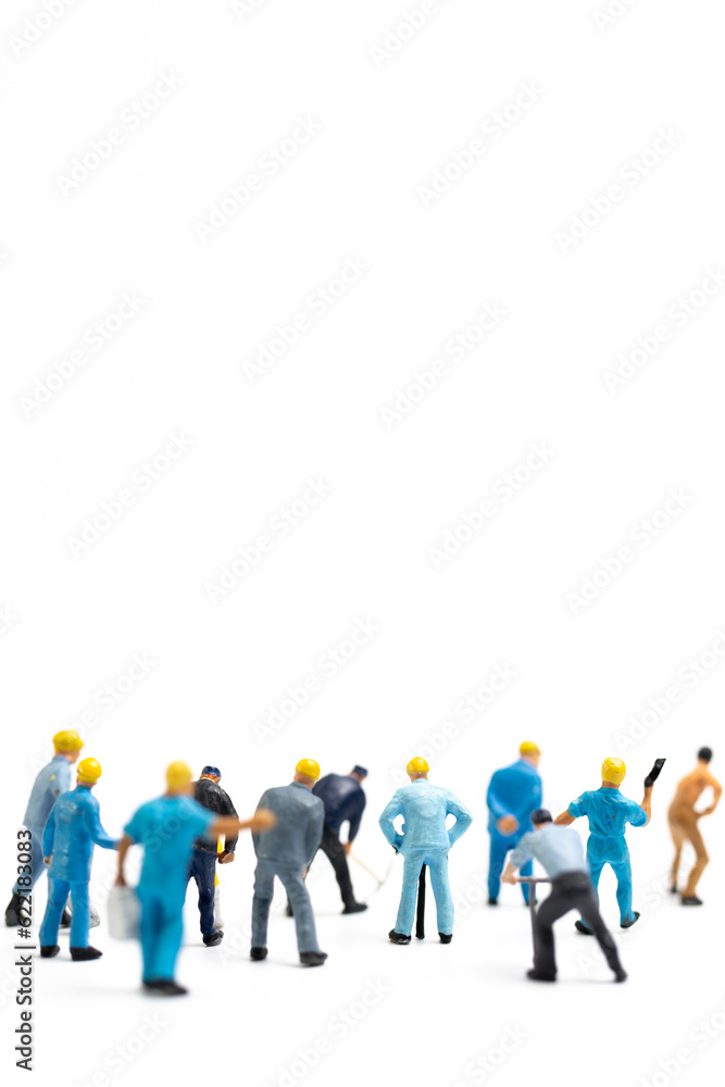 Miniature people , Worker team standing on white background, Labour day concept Miniature people , Worker team standing on white background, Labour day concept