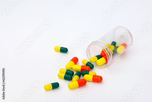 Medicine capsule on white background. Scattered capsules medicine