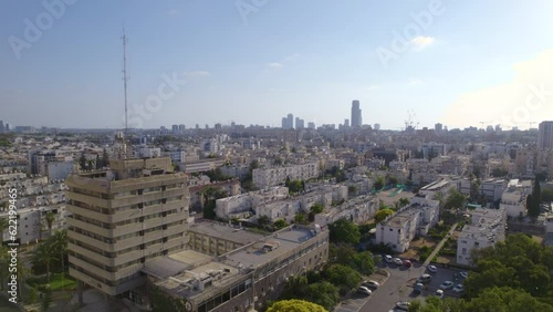 Flyind towards the old city hall of Holon, Israel photo