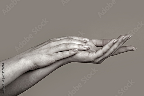 Reaching touching hands. Reach hand. Sensual touch. Beautiful Woman Hands. Female Hands Applying Cream, Lotion. Spa and Manicure concept. Female hands. Soft skin, skincare concept. Hand Skin Care.