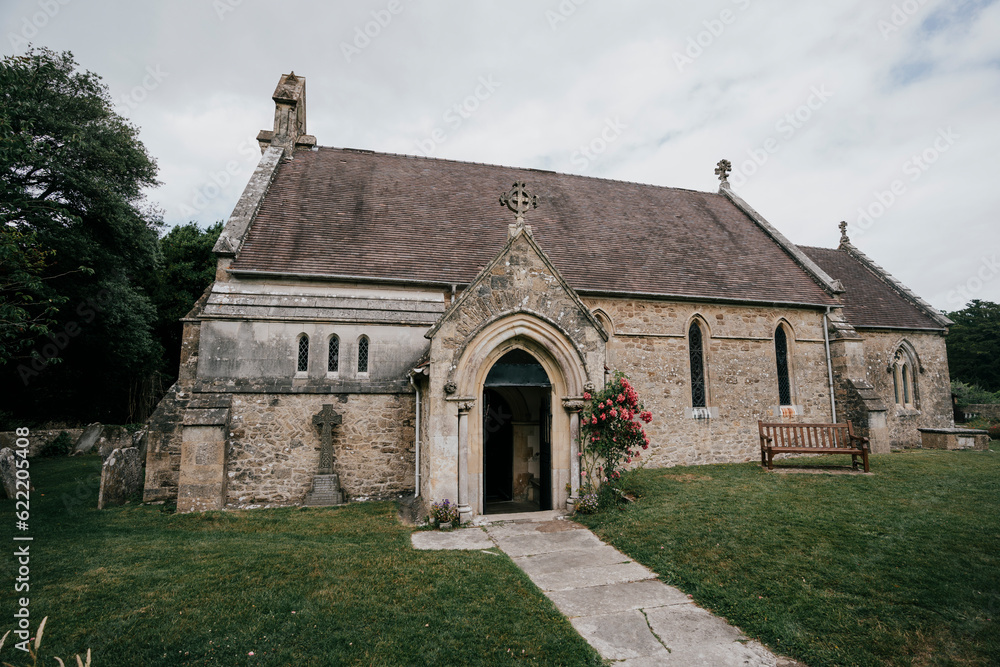 An old church in a town with a garden entrance An old church in a town with a garden entrance