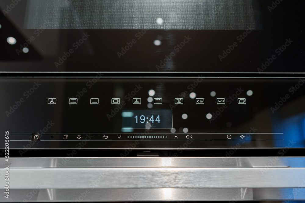 New ovens in household appliance section in store New ovens in household appliance section in store