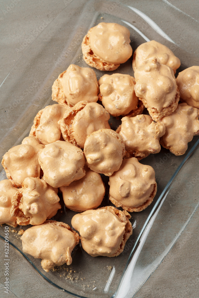 Crunchy homemade cookies on glass plate on gray background Crunchy homemade cookies on glass plate on gray background