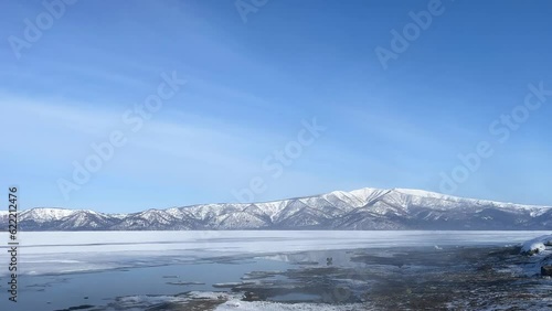 Wallpaper Mural Swans flying over misty frozen thermal waters of a lake Torontodigital.ca