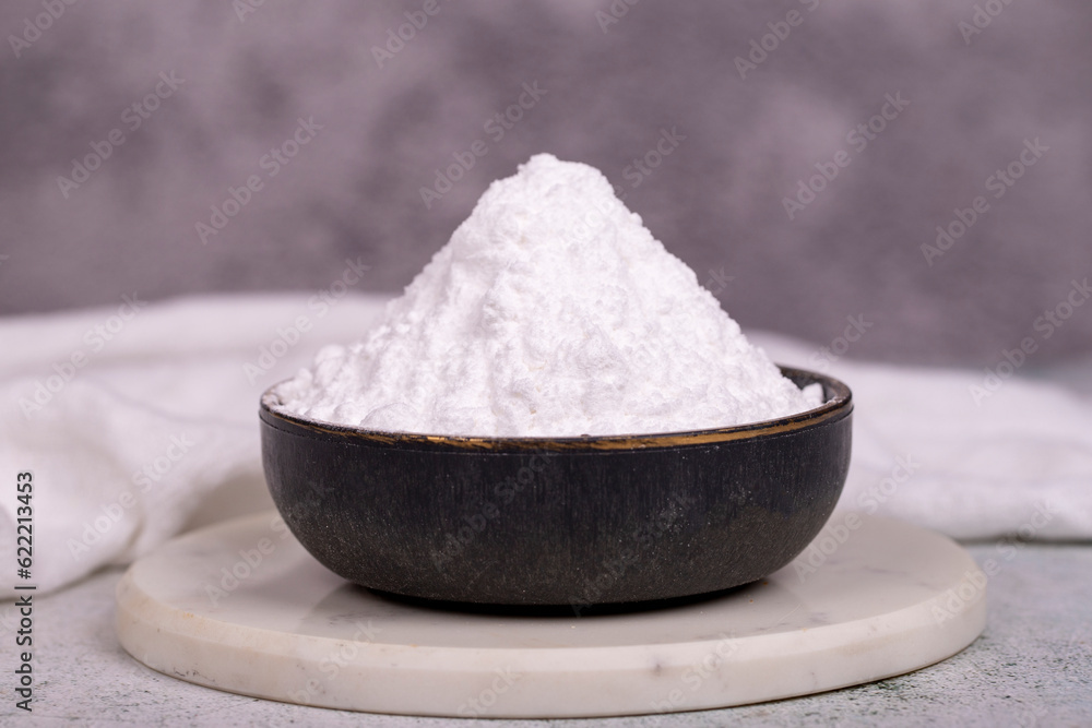Wheat starch on stone background. Wheat starch in bowl. close up Wheat starch on stone background. Wheat starch in bowl. close up