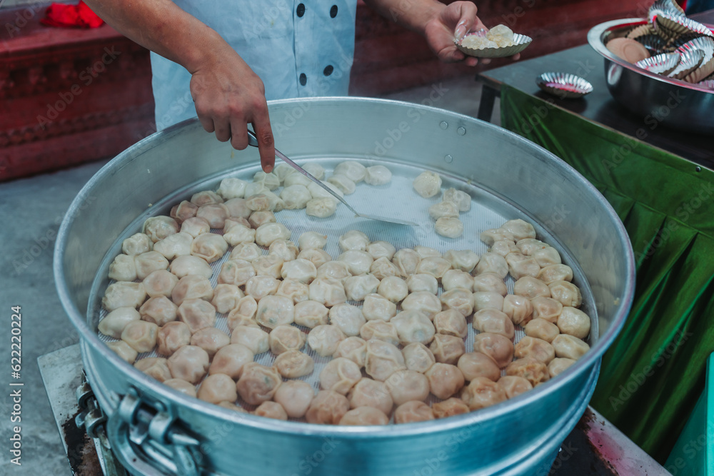 Nepalese steamed dumpling momo serving at the party. Close up image.