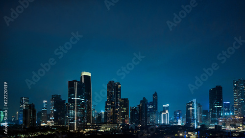 Panoramic Jakarta skyline with urban skyscrapers at night © Leo Lintang