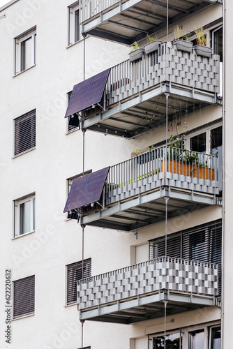 Solar Panels on Balcony of Apartment Building. Modern High rise Building with Solar Panel System on Balconies. Solar Energy of Apartments.