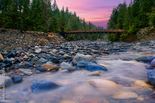 River in forest. Long exposure, water slow shutter speed, fog when sunrise in winter season,