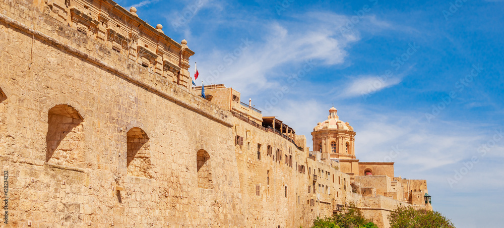 View of Mdina wall, castle and church, Malta, Europe. Sunny summer