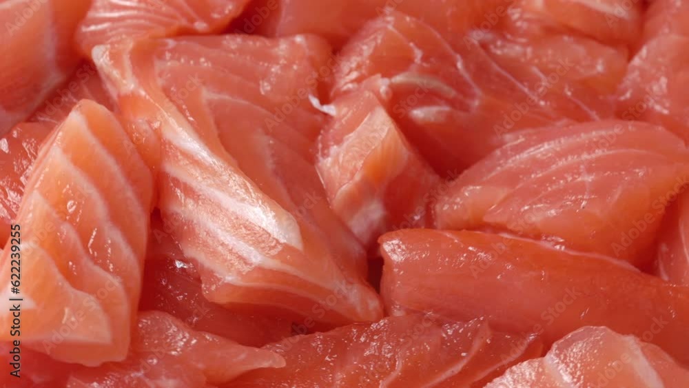 red fish slices, rotation in circle. salmon slices Turning. selective focus red fish slices, rotation in circle. salmon slices Turning. selective focus