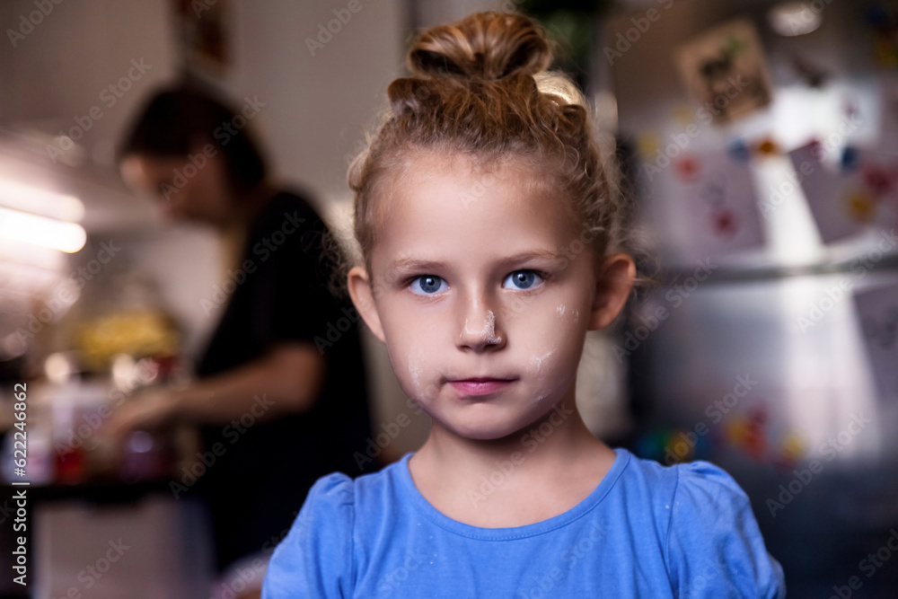 Portrait (face) of little girl 5 year old with cheek in flour at ...