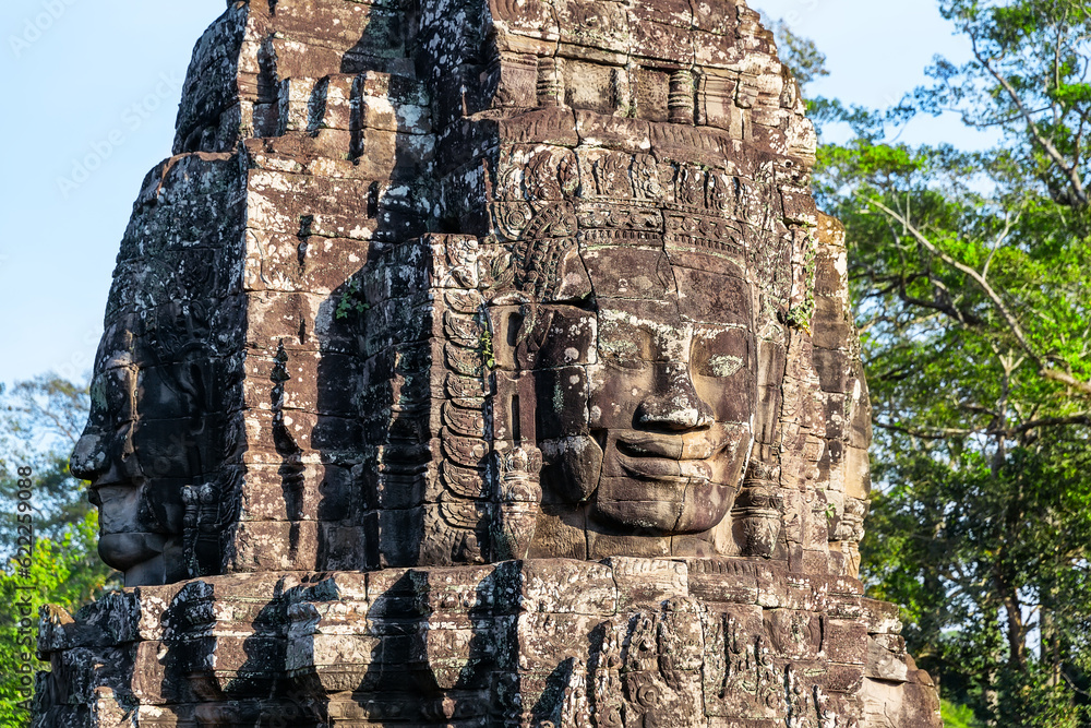 The stone faces of the khmer king on the wall of Bayon Temple, Angkor Thom, Siem Reap, Cambodia.