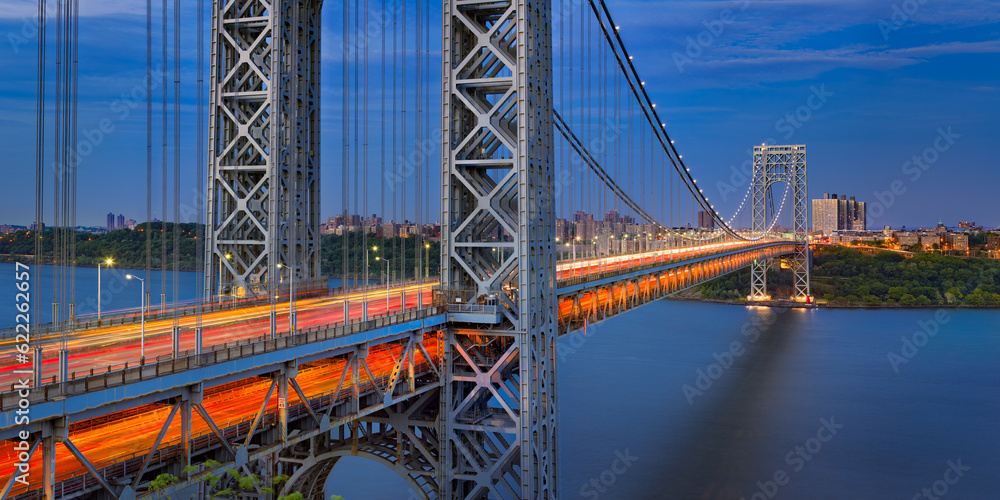 The George Washington Bridge (long-span suspension bridge) across the Hudson River in evening connecting New Jersey with Upper Manhattan, New York City