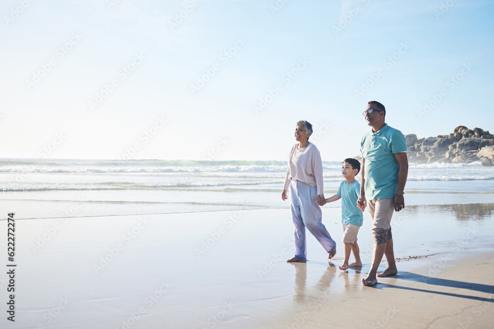 Beach, walking and senior couple with boy for bonding, quality time and relaxing in nature. Family, travel and happy elderly man and woman with child by ocean on holiday, vacation and adventure