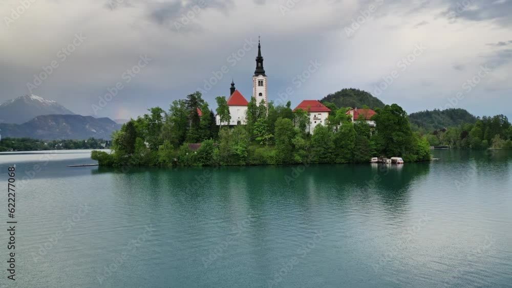 Aerial around view of Bled lake with the Pilgrimage Church of the Assumption of Maria on a small island after sunset, Slovenia, 4k Aerial around view of Bled lake with the Pilgrimage Church of the Assumption of Maria on a small island after sunset, Slovenia, 4k