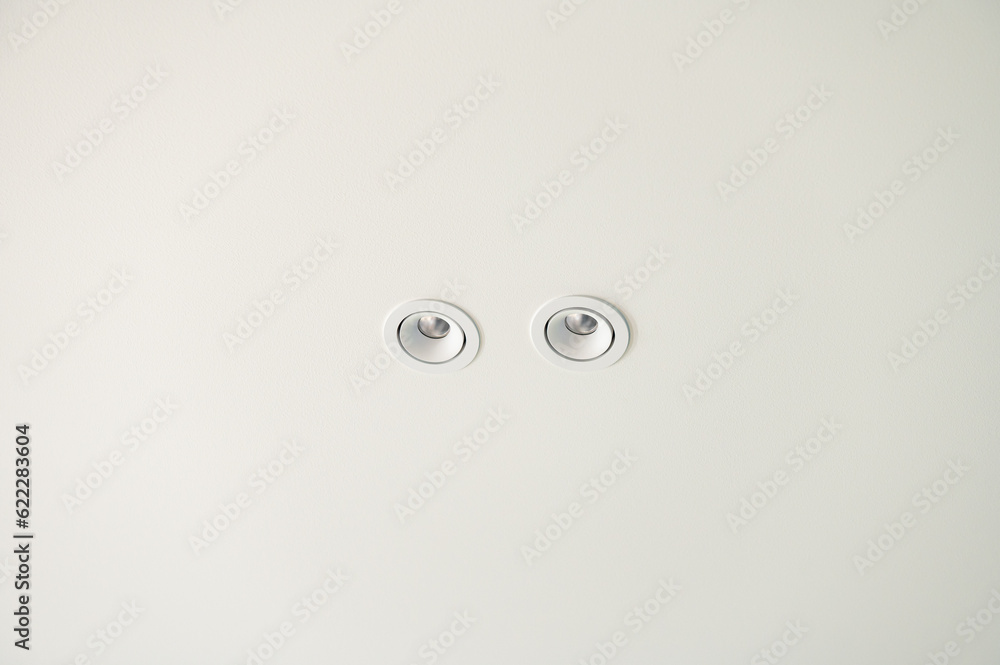 Spot lamp on a white ceiling Spot lamp on a white ceiling