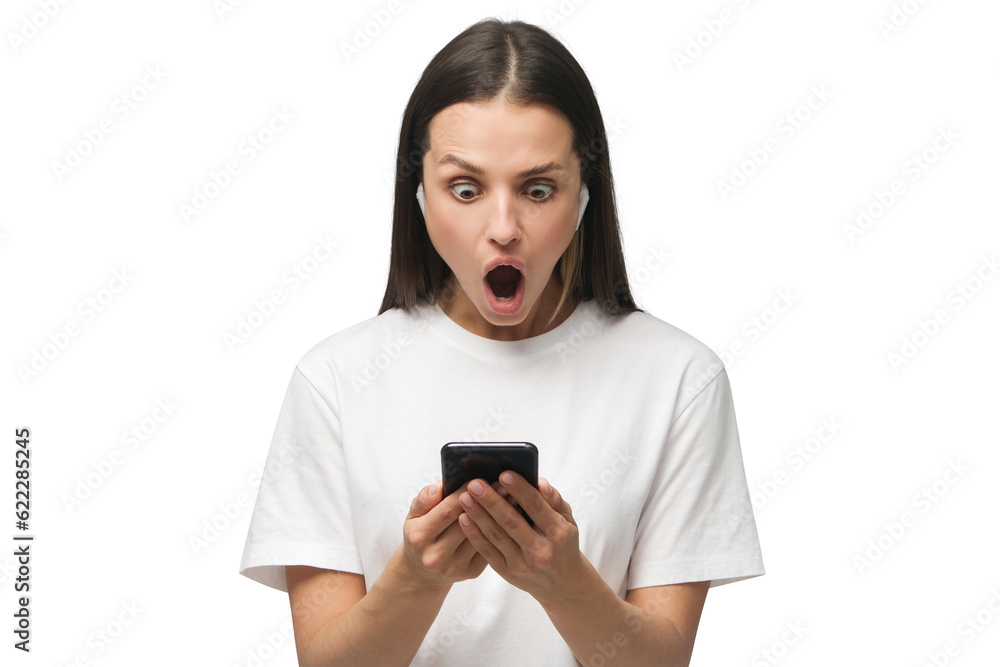 Shock content. Young woman impressed by media content from web on display of her smartphone Shock content. Young woman impressed by media content from web on display of her smartphone
