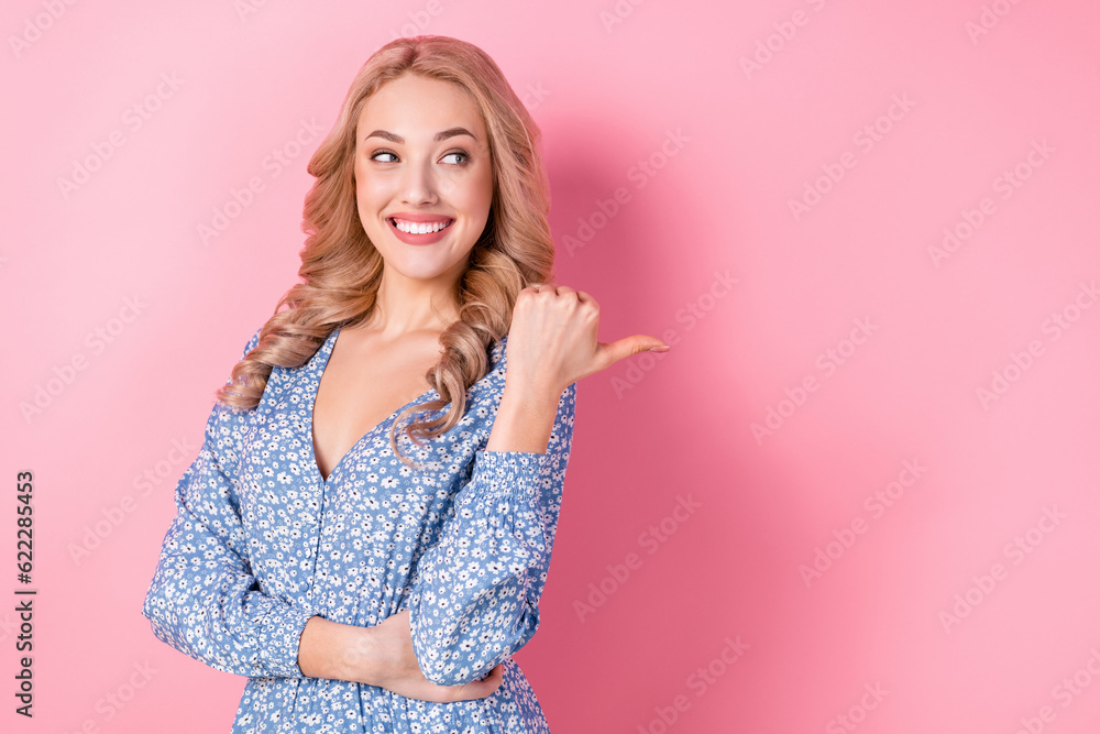 Portrait of adorable cheerful girl beaming smile look direct thumb finger empty space offer isolated on pink color background Portrait of adorable cheerful girl beaming smile look direct thumb finger empty space offer isolated on pink color background
