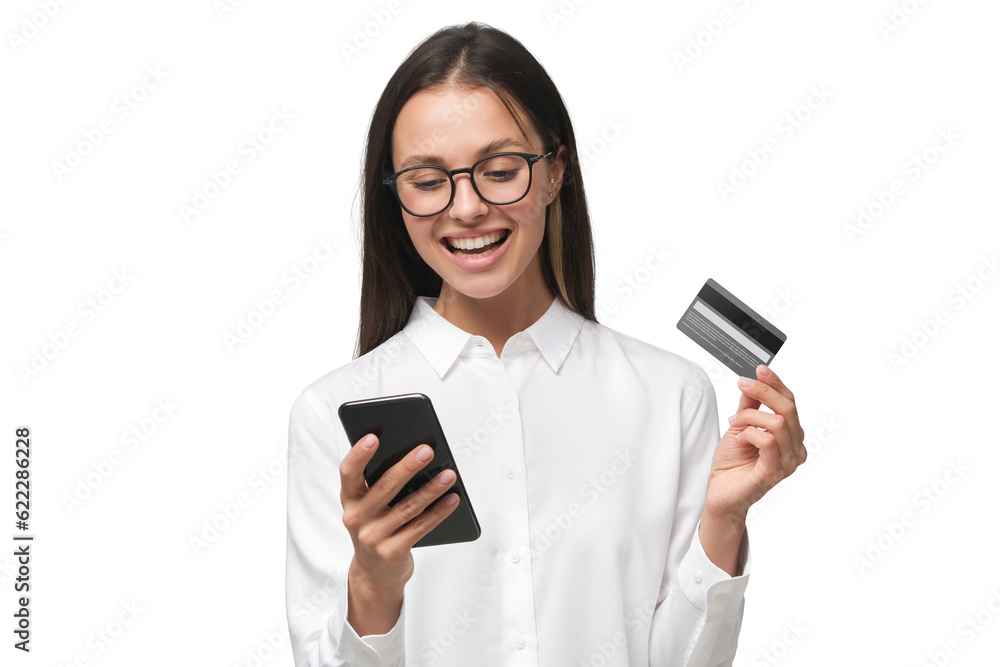Young smiling woman holding credit card and phone Young smiling woman holding credit card and phone
