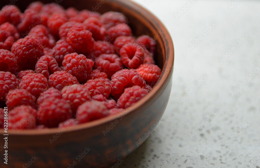 Red fresh raspberries in a bowl Red fresh raspberries in a bowl