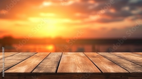 Empty wooden table top with blur background of sunset