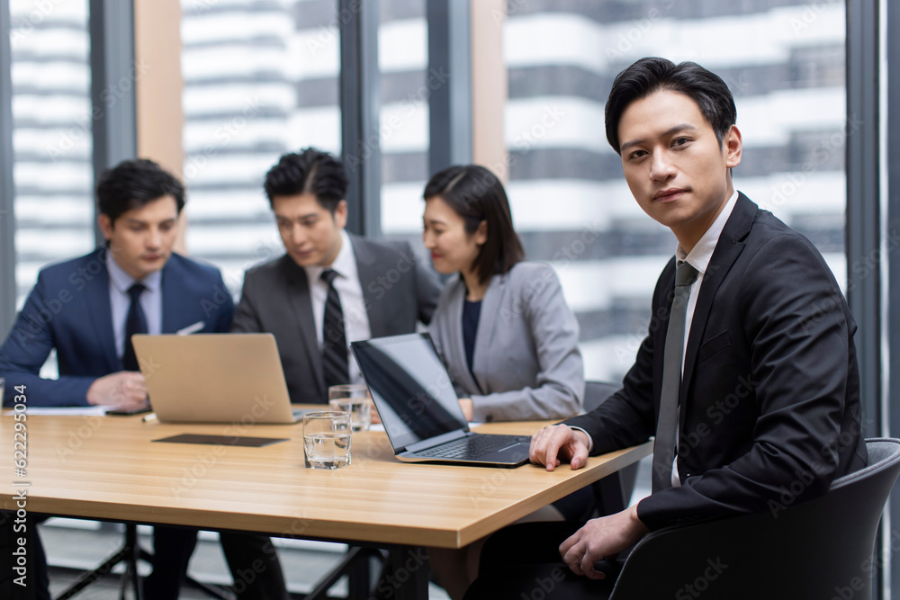 Confident Chinese business people having a meeting Confident Chinese business people having a meeting