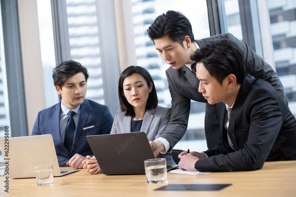 Confident Chinese business people having a meeting Confident Chinese business people having a meeting