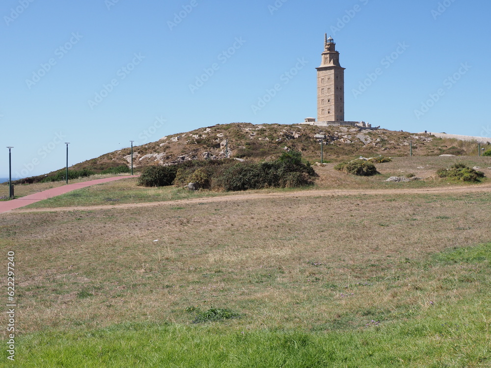 Grassy hill with tower of Hercules in A Coruna city at Galicia, Spain