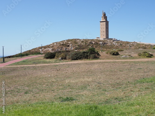 Grassy hill with tower of Hercules in A Coruna city at Galicia, Spain © Jakub Korczyk