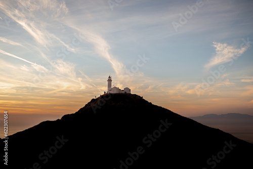 Lighthouseand clouds. Knidos lighthouse at sunset - Datca Turkey