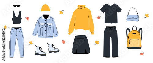 Fototapeta Naklejka Na Ścianę i Meble -  Set of autumn clothes and accessories. Female fashion flat illustration. Casual style trends. Sweater, skirt, shoes, jeans, jacket and other street wear.