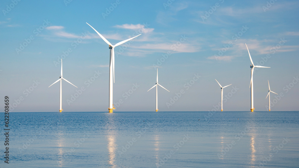 Windmill Park with a blue sky windmill turbines park in the ocean. Netherlands Europe the biggest wind park in the Netherlands
