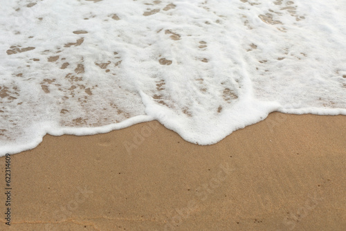 Sea Wave on the Sand Beach Close Up Background