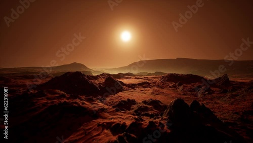 Front aerial shot at sunset of the red Martian desert surface on Mars. Sci-Fi landscape photo