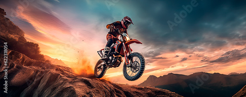Motorcycle rider jumping on a rock.