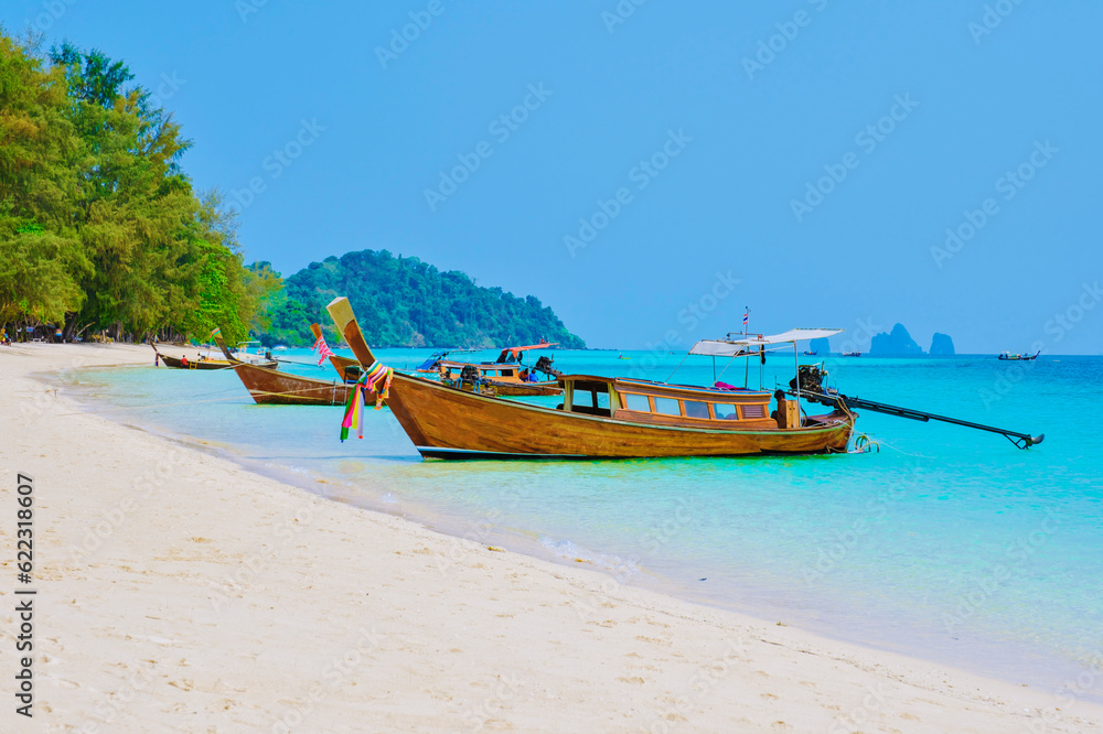 Koh Kradan Island with a white tropical beach and turqouse colored ocean. Koh Kradan Island with a white tropical beach and turqouse colored ocean.