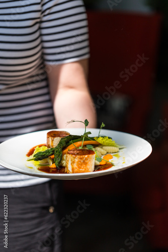 woman holding a plate of food