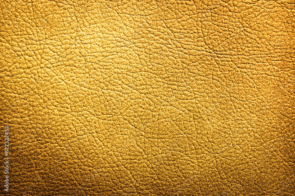 Fototapeta premium Golden textured surface as background, closeup view