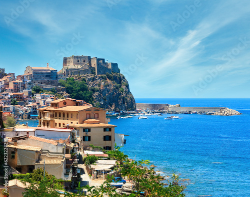 Summer Tyrrhenian Sea coast and beautiful Scilla town view, Calabria, Italy. People unrecognizable.